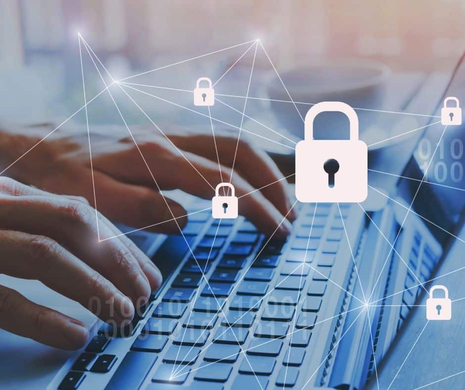 Cybersecurity concept: hands typing on a laptop with interconnected lock icons representing data protection and network security.